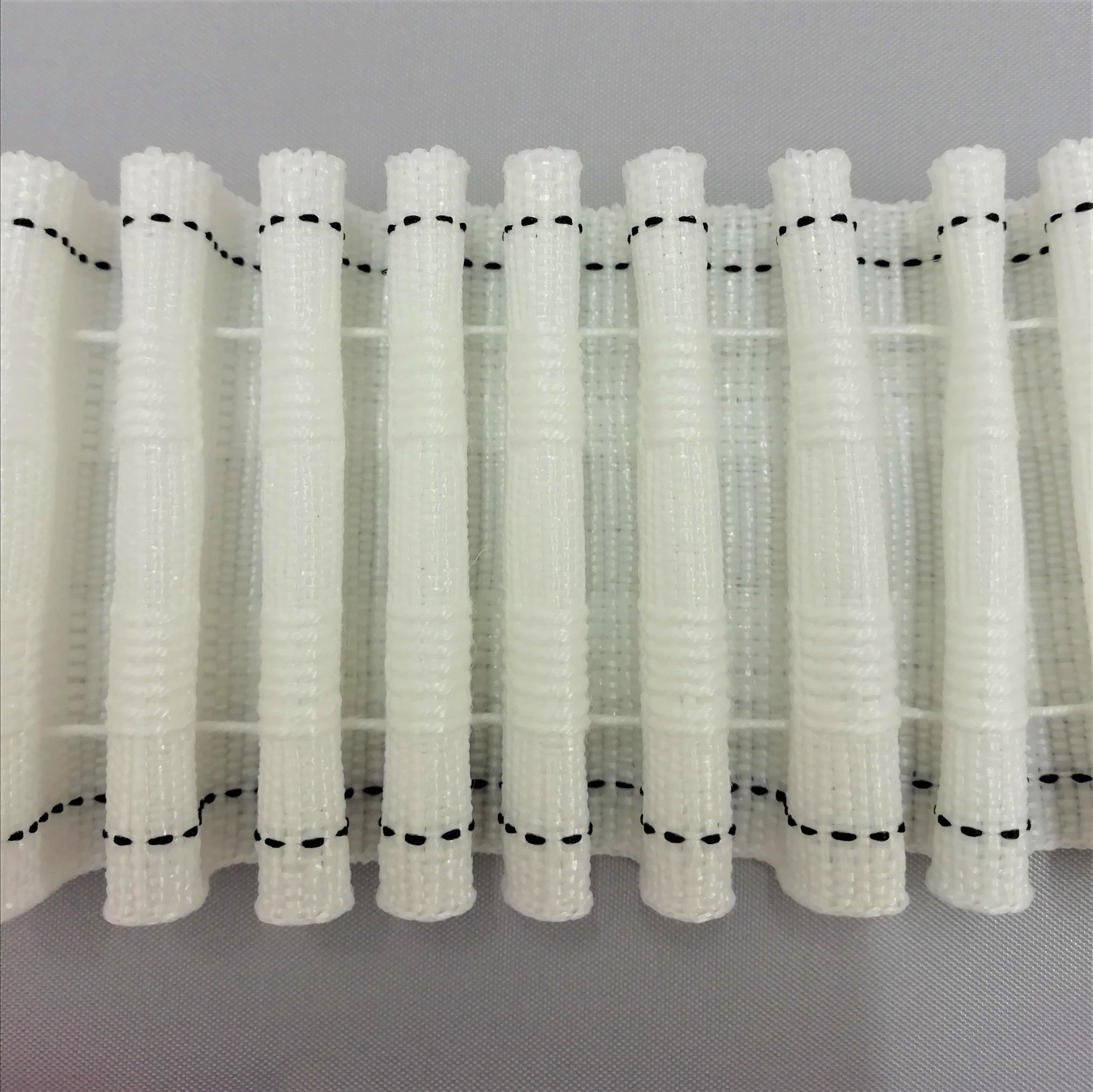 A close up of pencil pleat heading tape