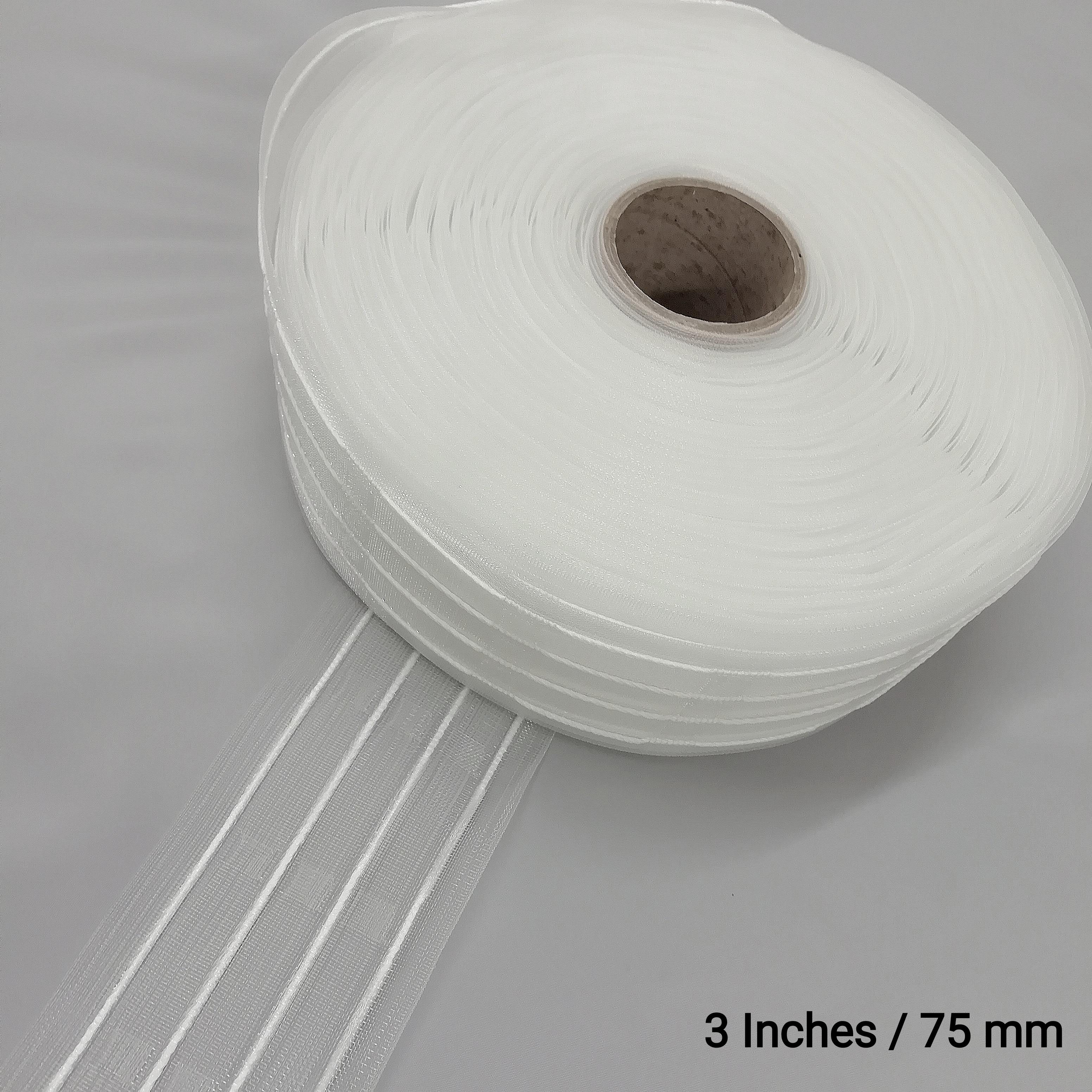 A roll of transparent 3 inch net pleat curtain tape