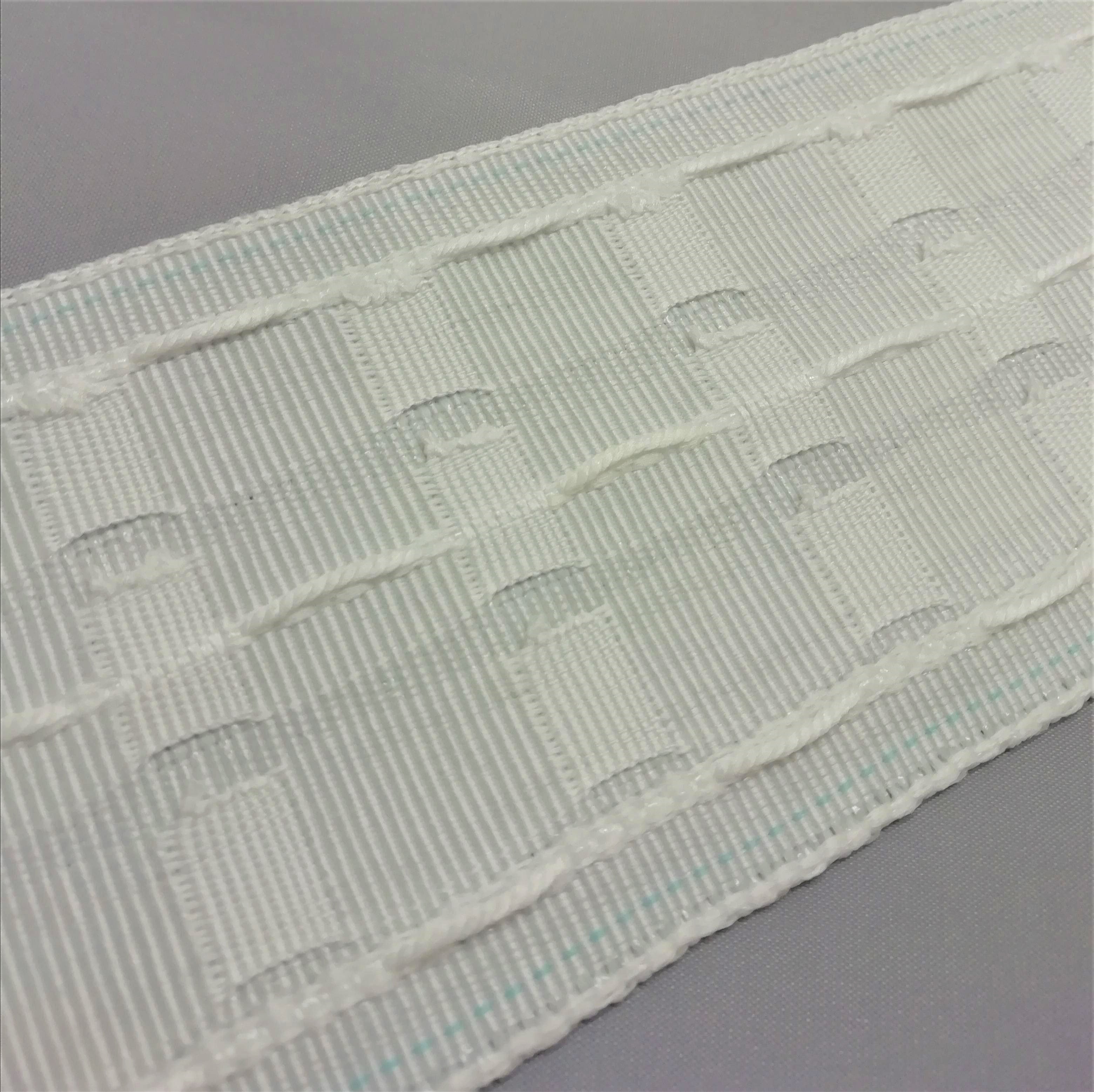 close up of the drawcords and woven pockets on 3 inch pencil pleat curtain tape
