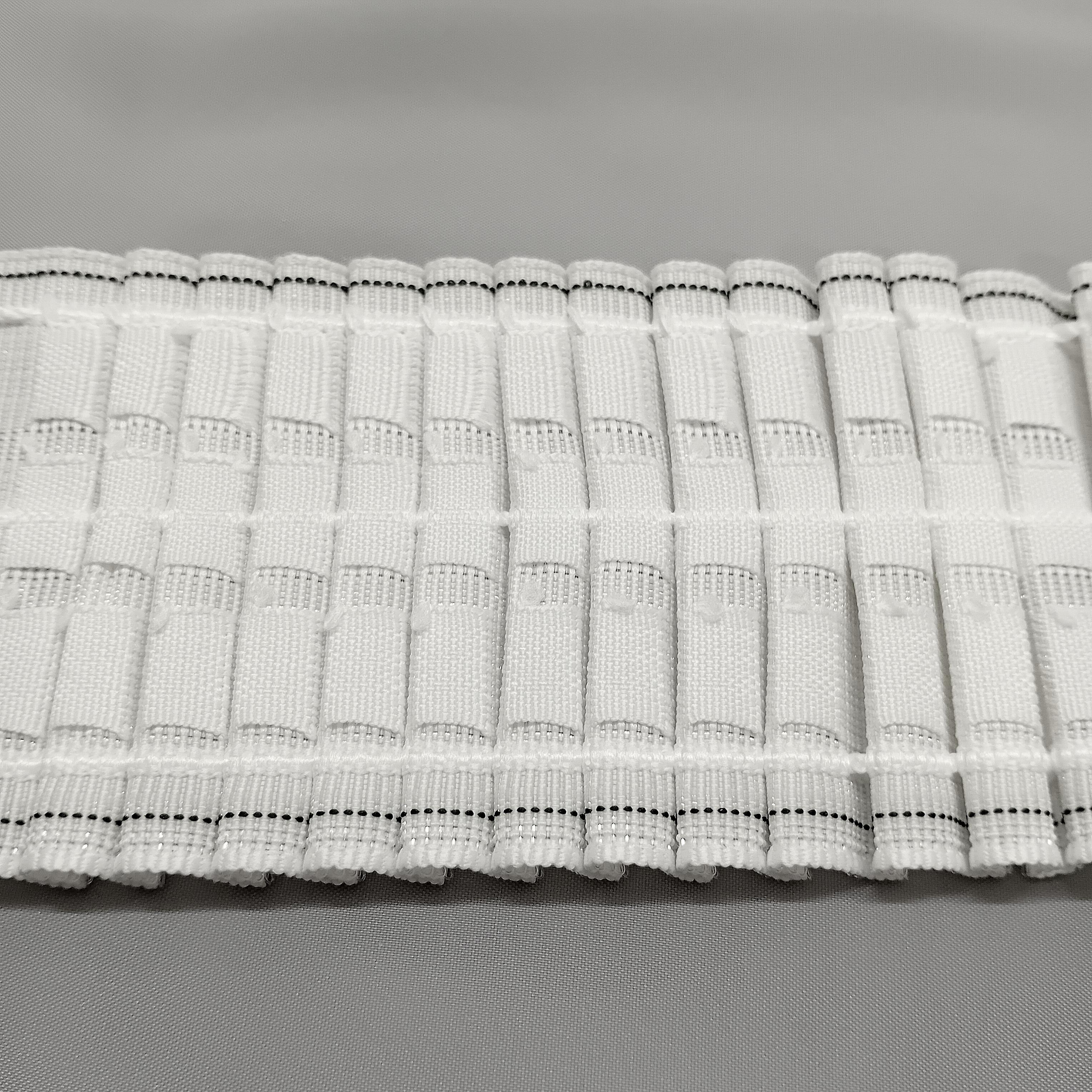 3 inch F R curtain tape showing the hook pockets