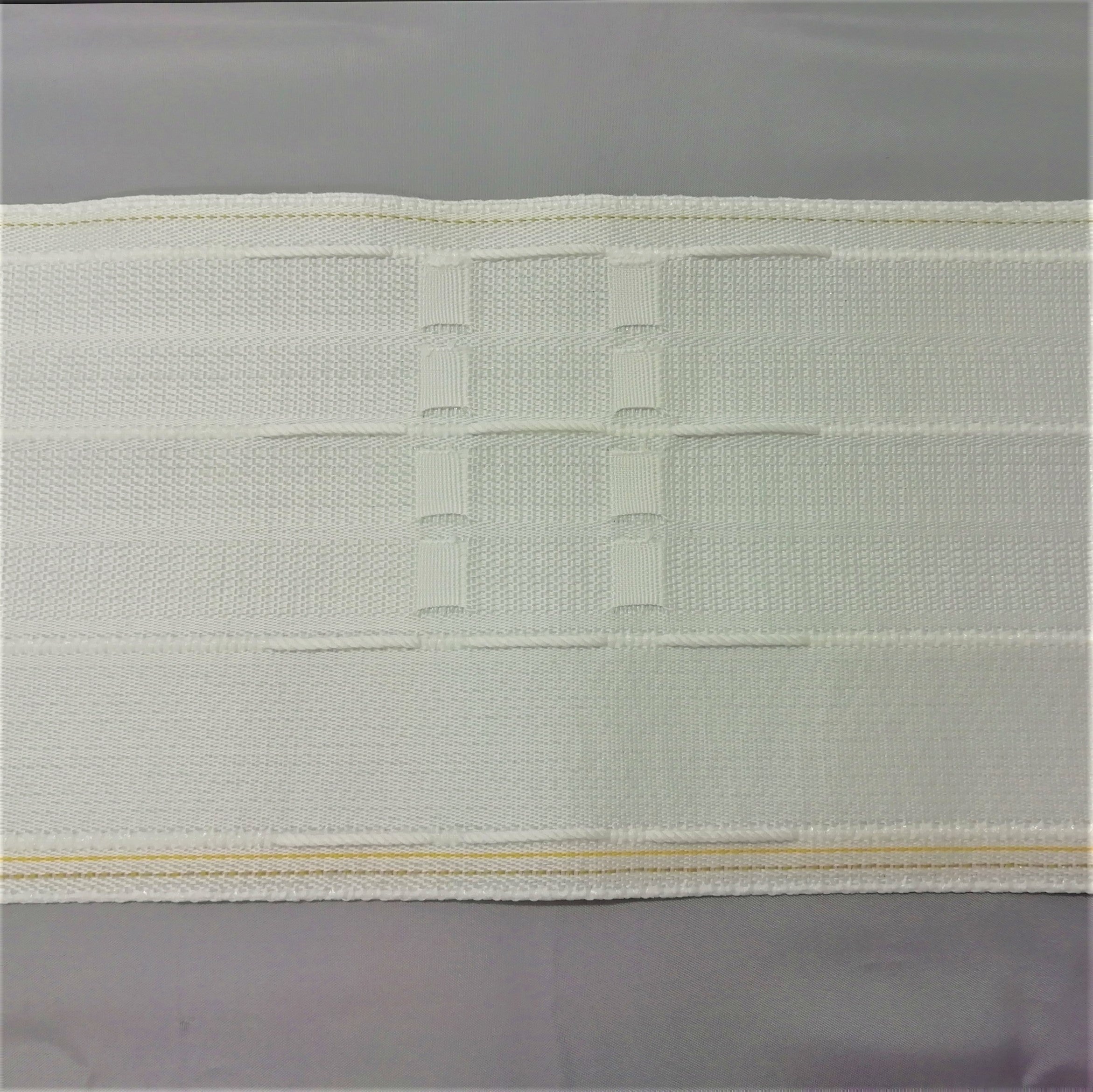 picture showing the drawcords and curtain hook pockets on a 145mm 6 inch pinch pleat curtain tape