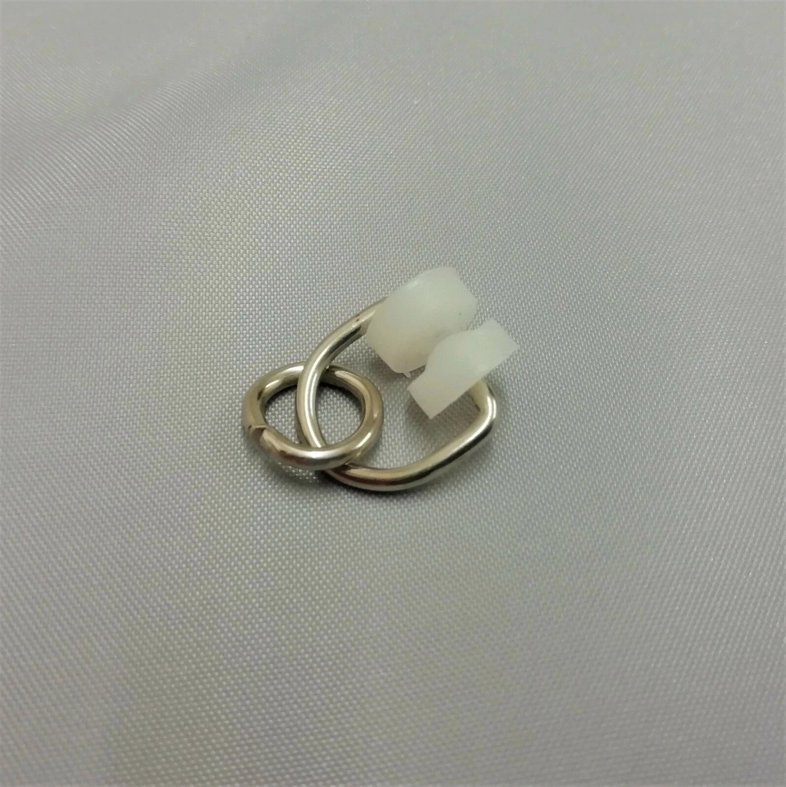 An I Beam glider made from metal with nylon wheels