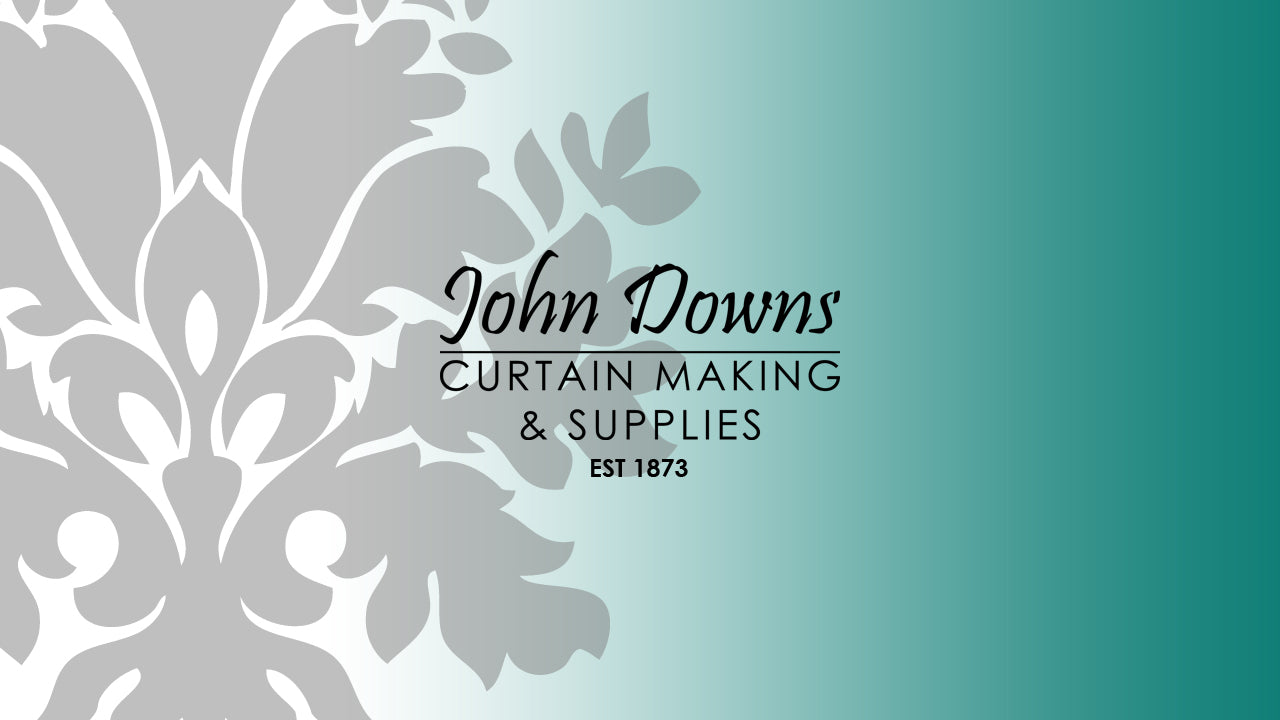 John Downs Curtain, Blind Making & Soft furnishing Supplies logo on a decorative background with a gradient blue color.