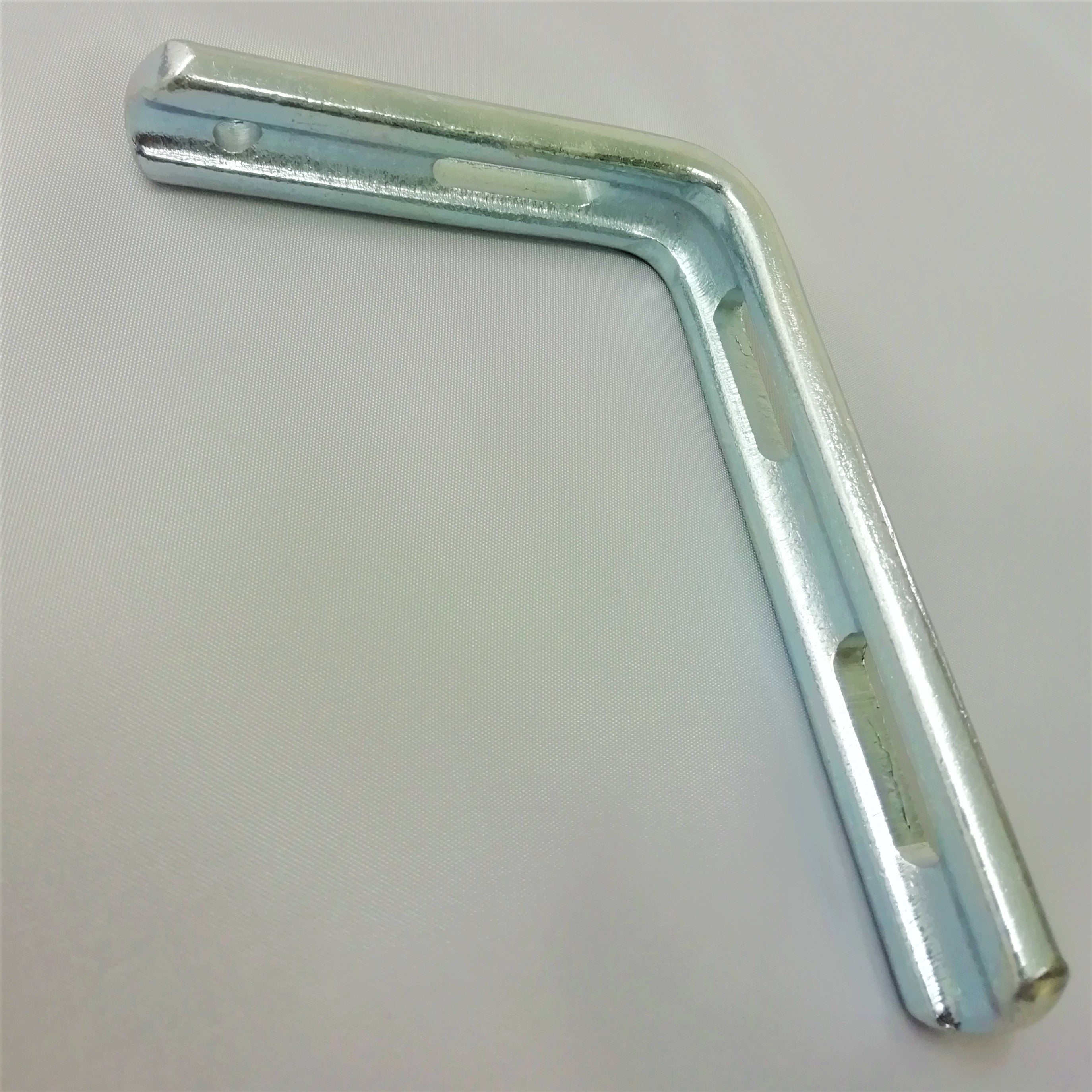 Steel L-shaped pelmet bracket on a light gray background