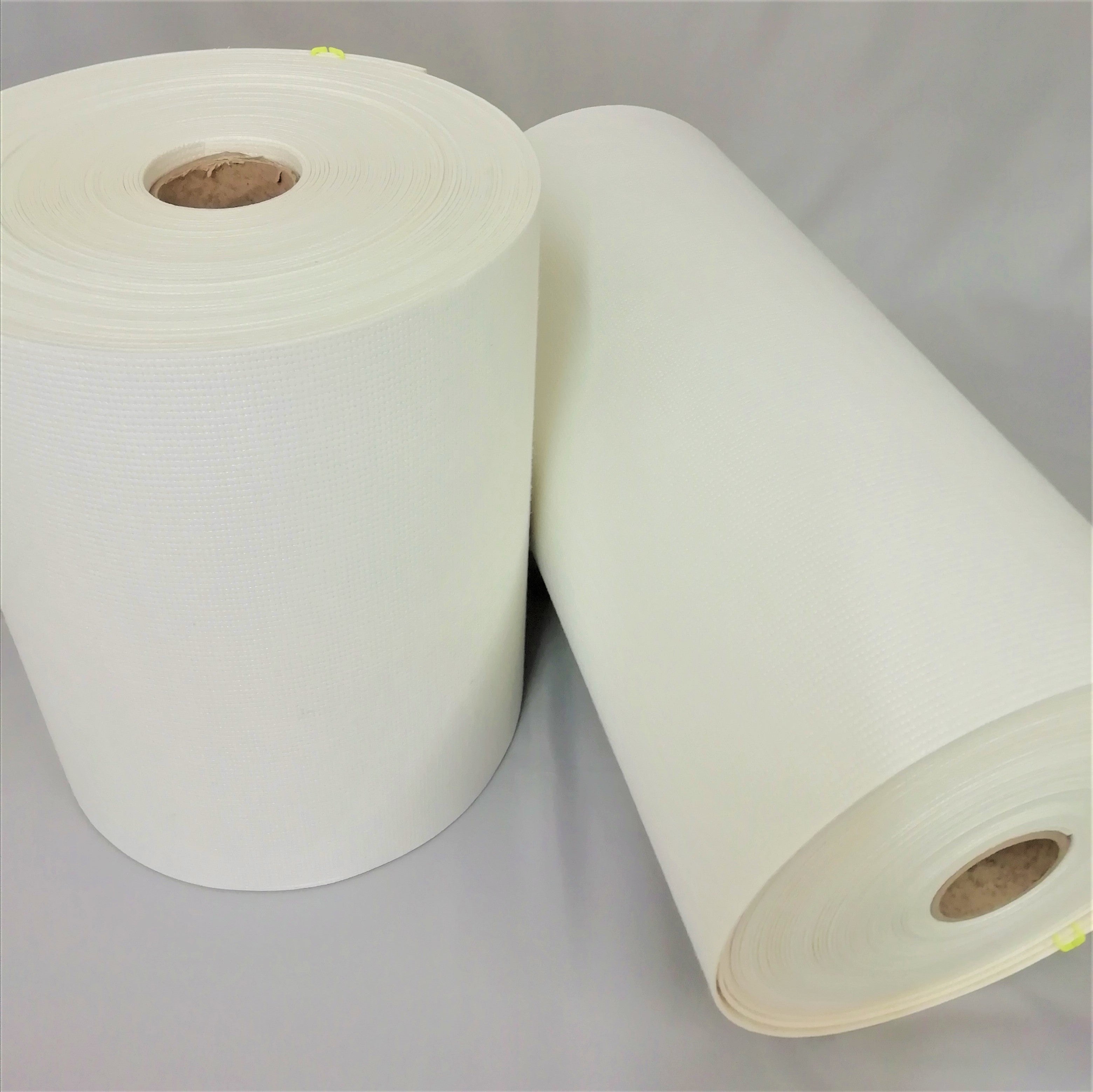 2 rolls of white pelmet buckram one 12 inches and the other 18 inches