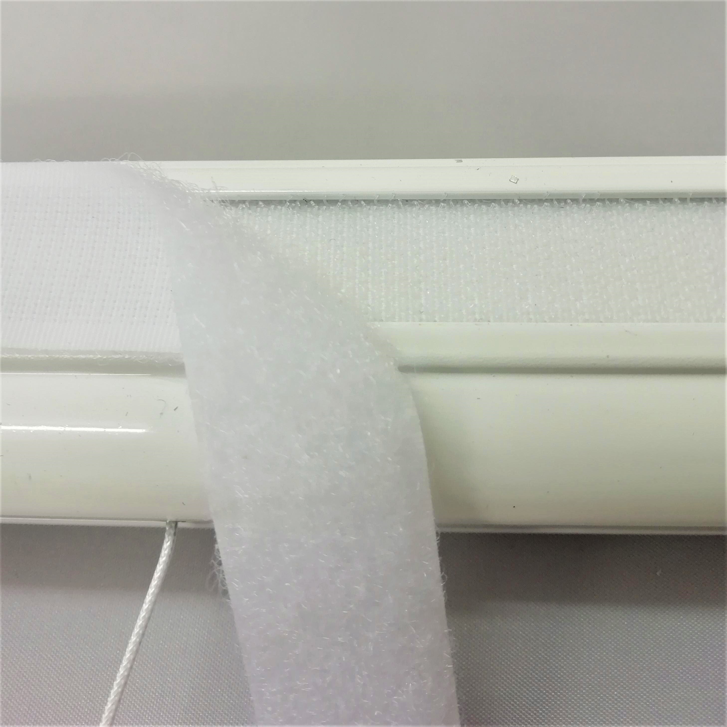 Hook tape attached to the roman blind headrail and look tape for sewing to the blind