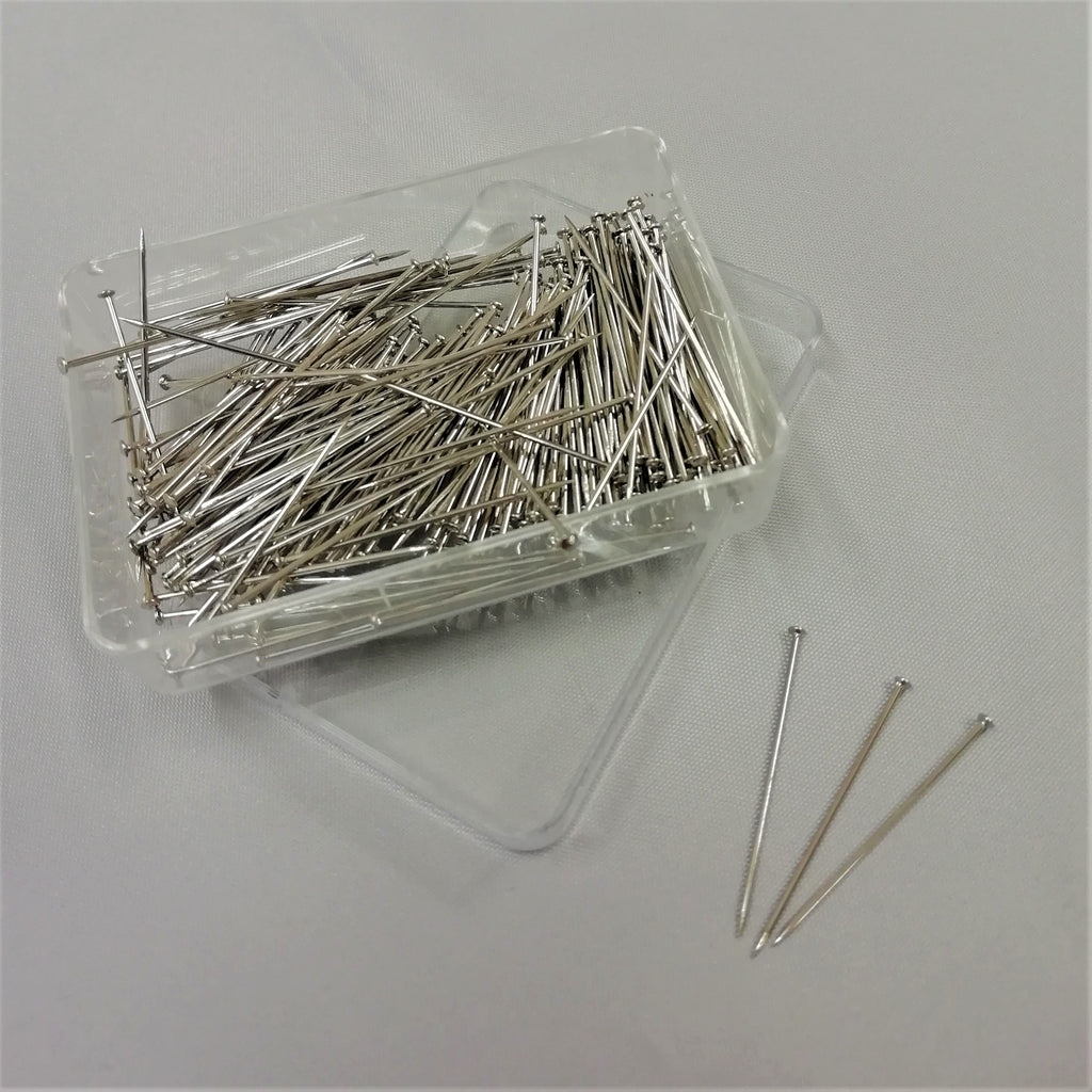 Steel pins in small plastic box