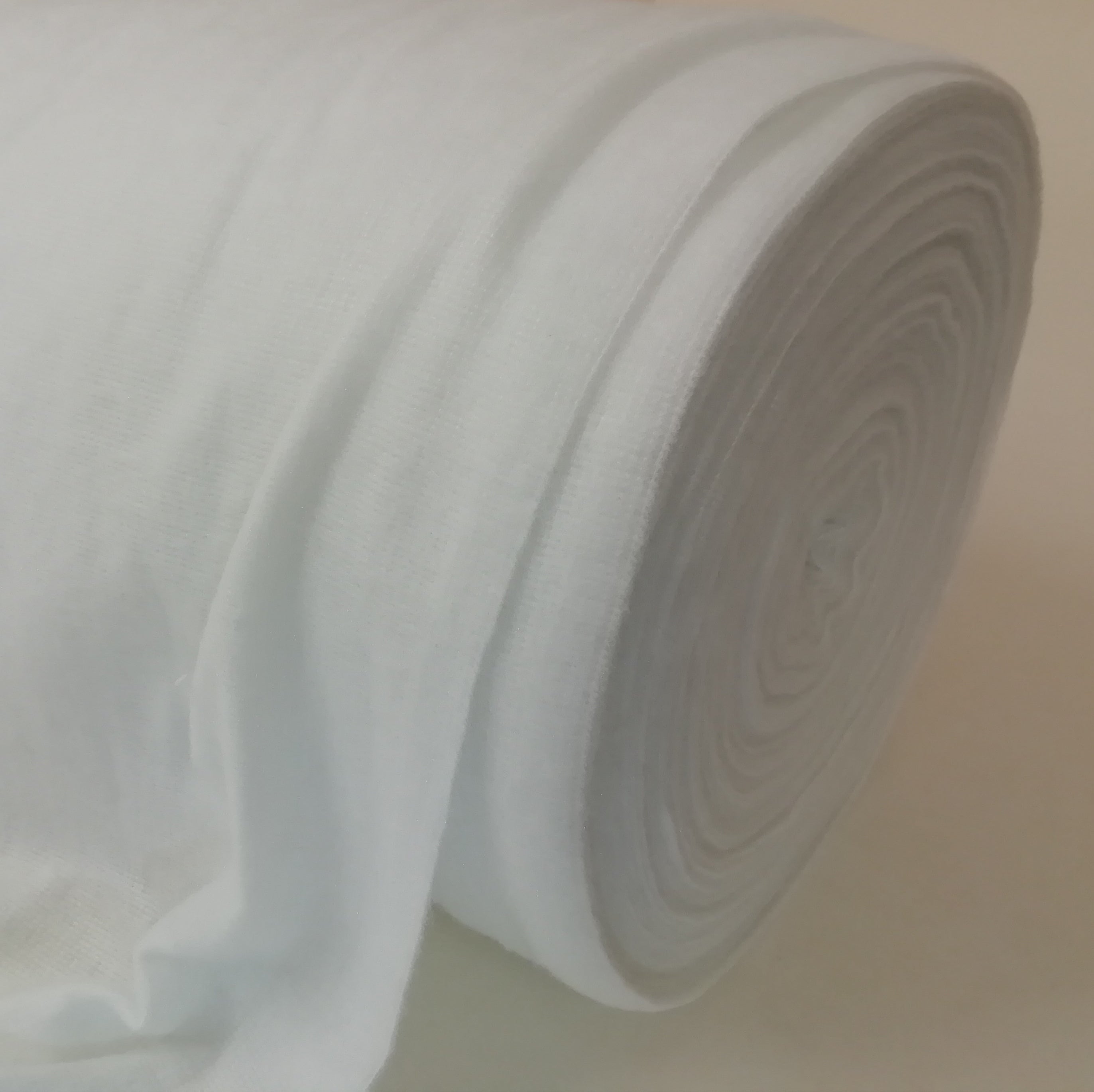 Roll of white light polyester curtain interlining