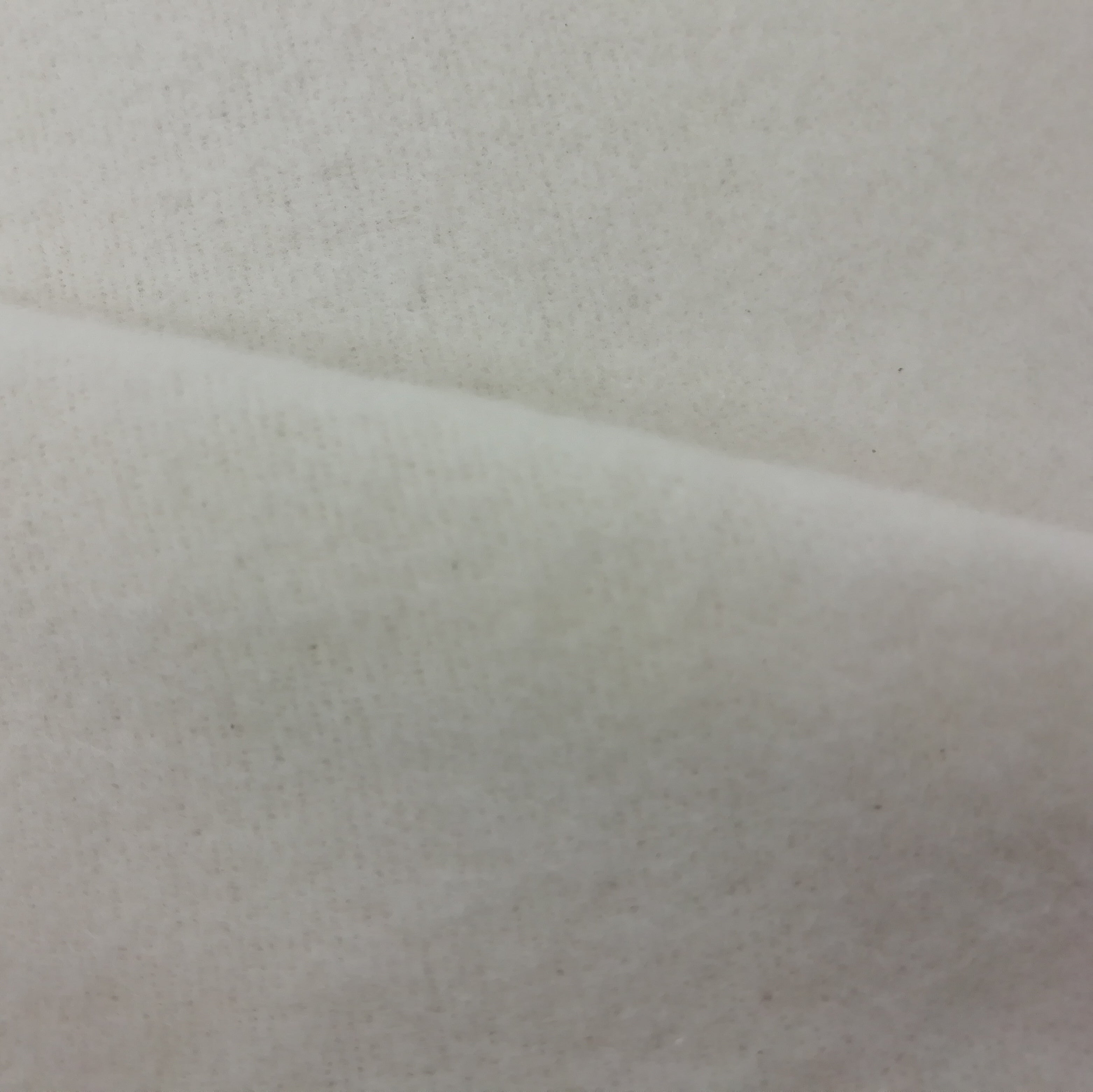 Close up of light cotton curtin interlining