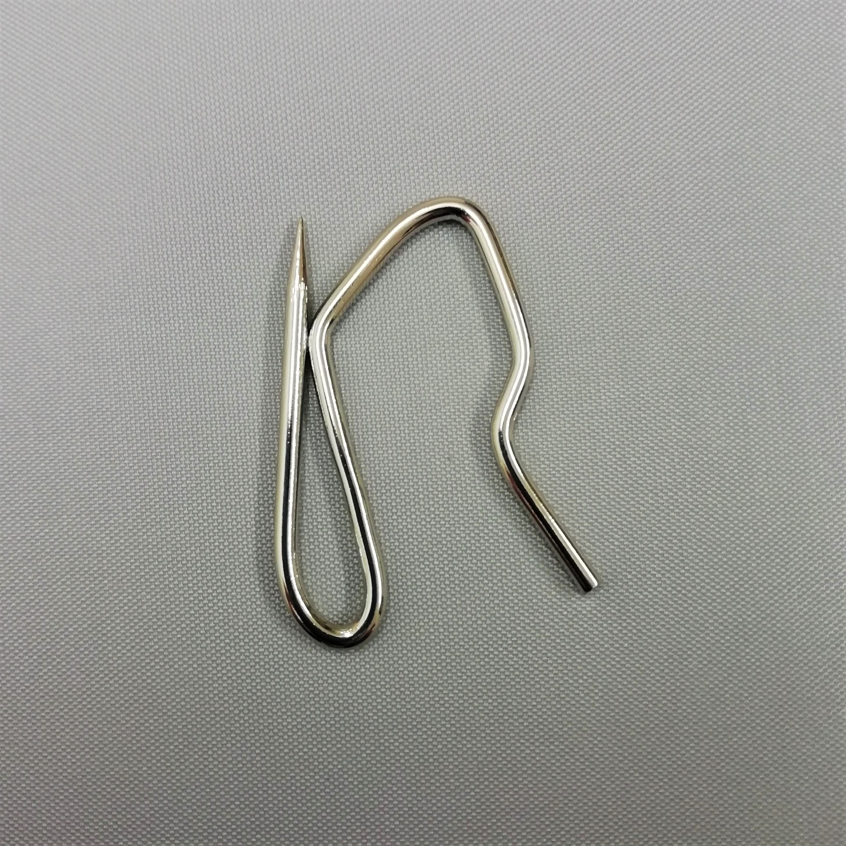 a pin hook with a sharp point for buckram headed curtains