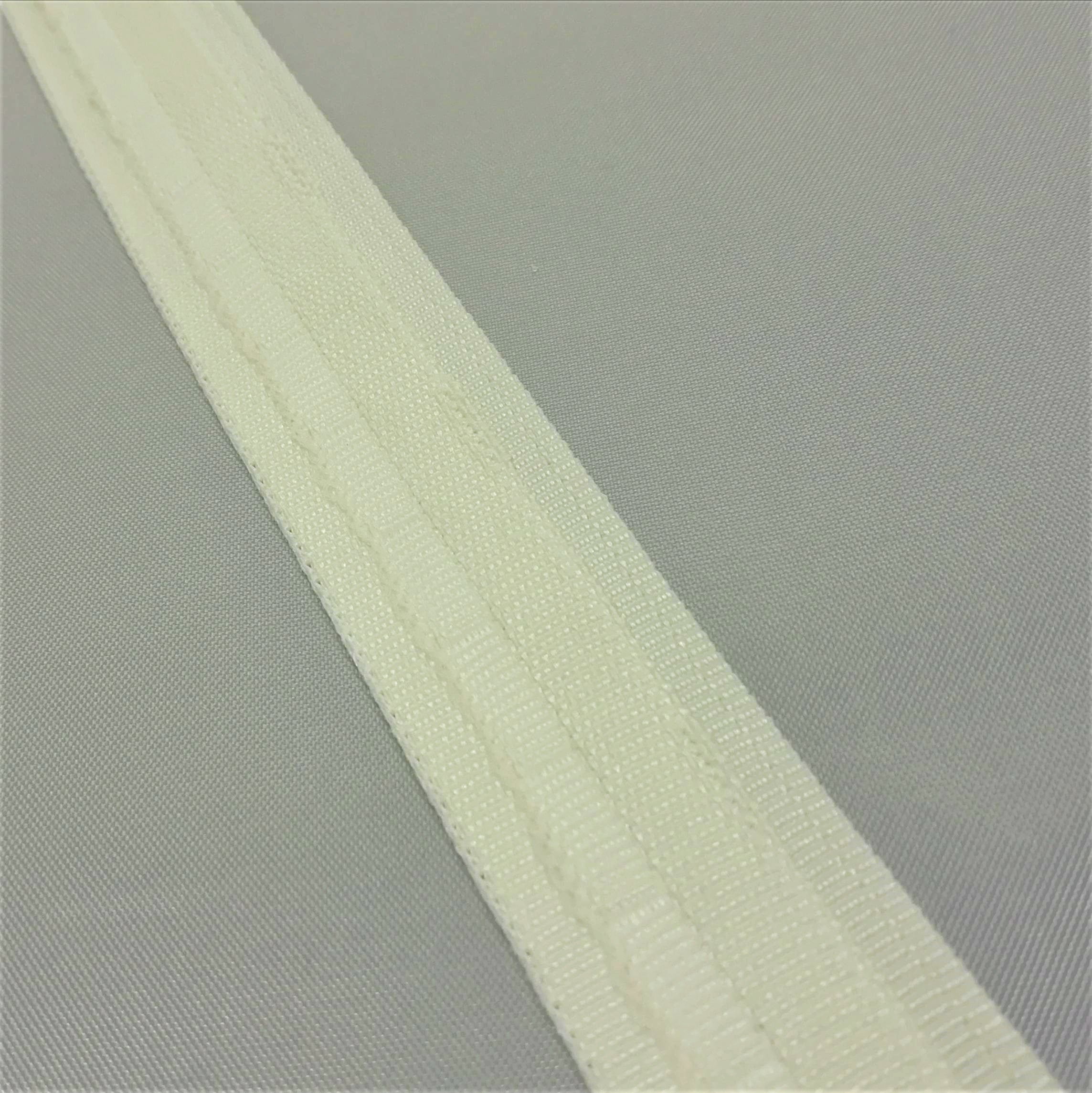 A close up of ivory roman blind tape