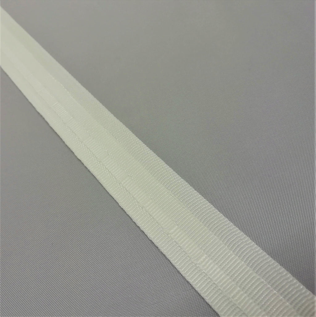 A close up of white roman blind tape