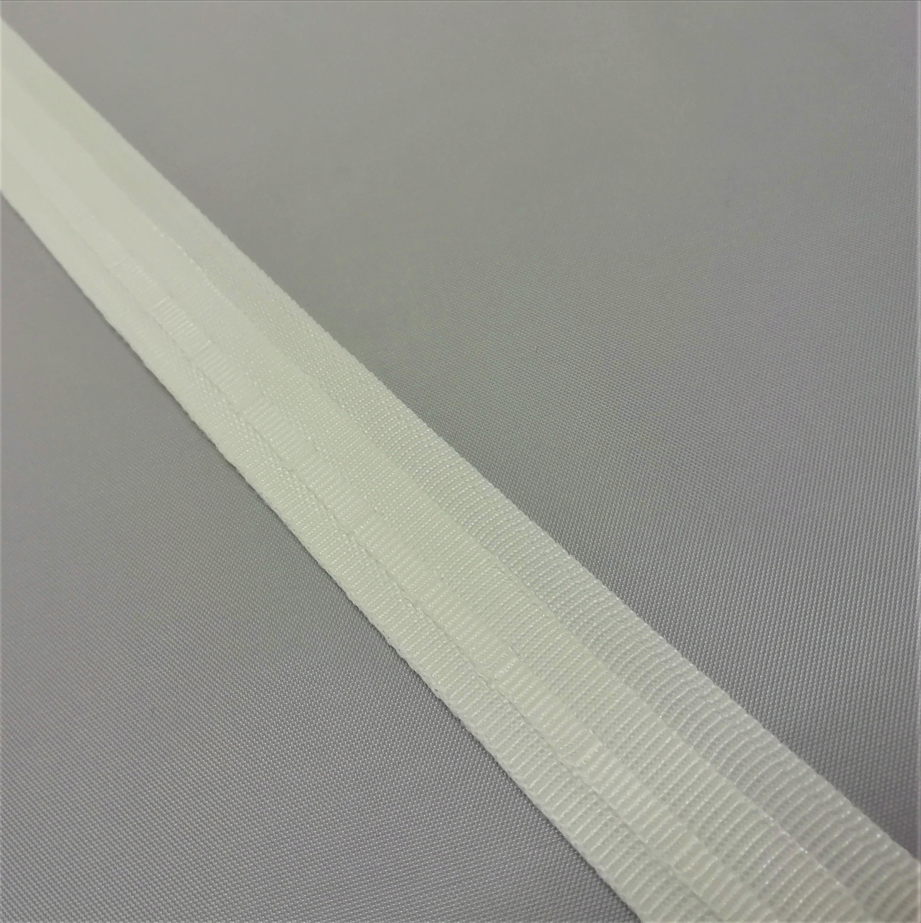 A close up of white roman blind tape