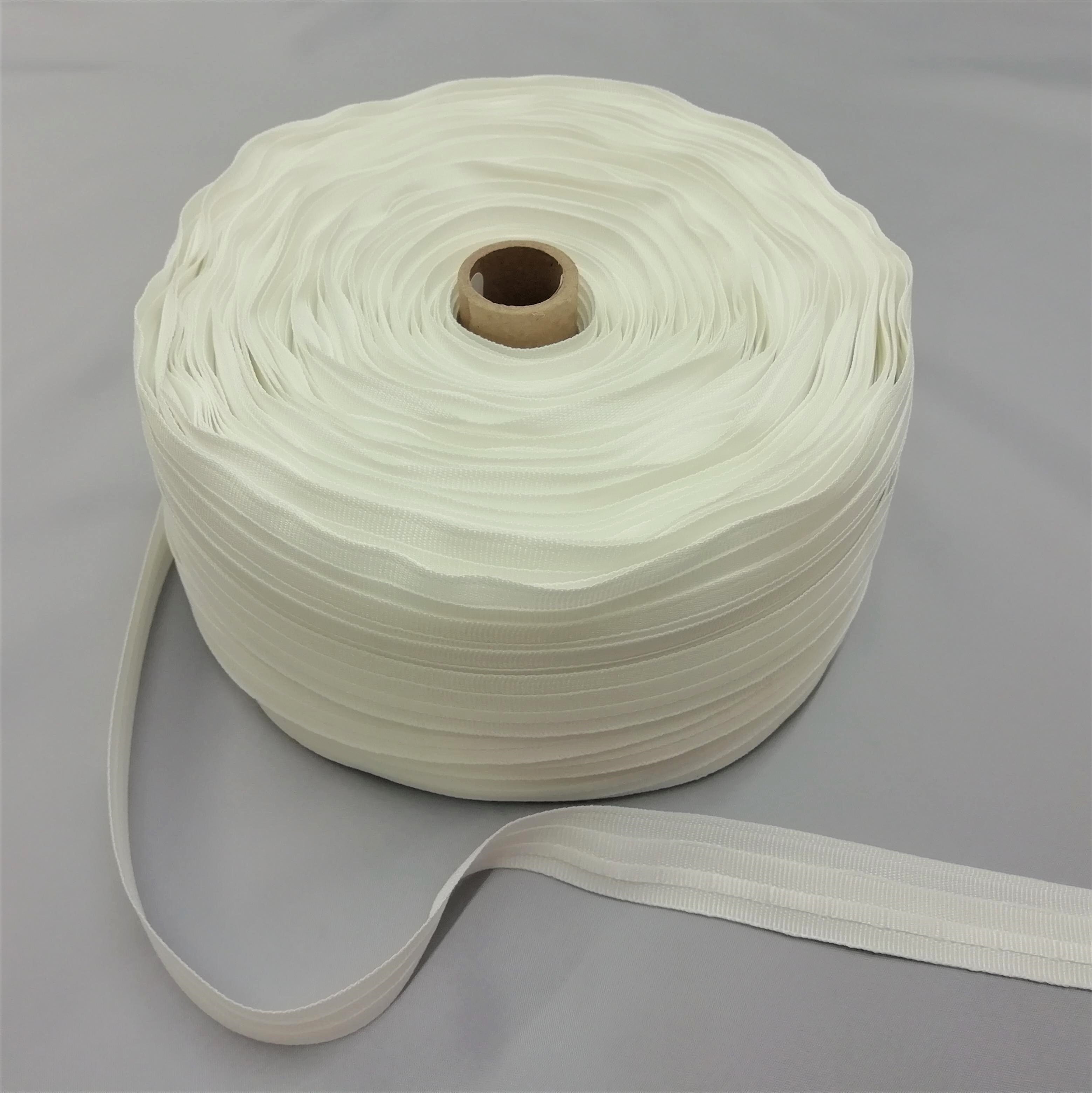 A roll of white roman blind tape