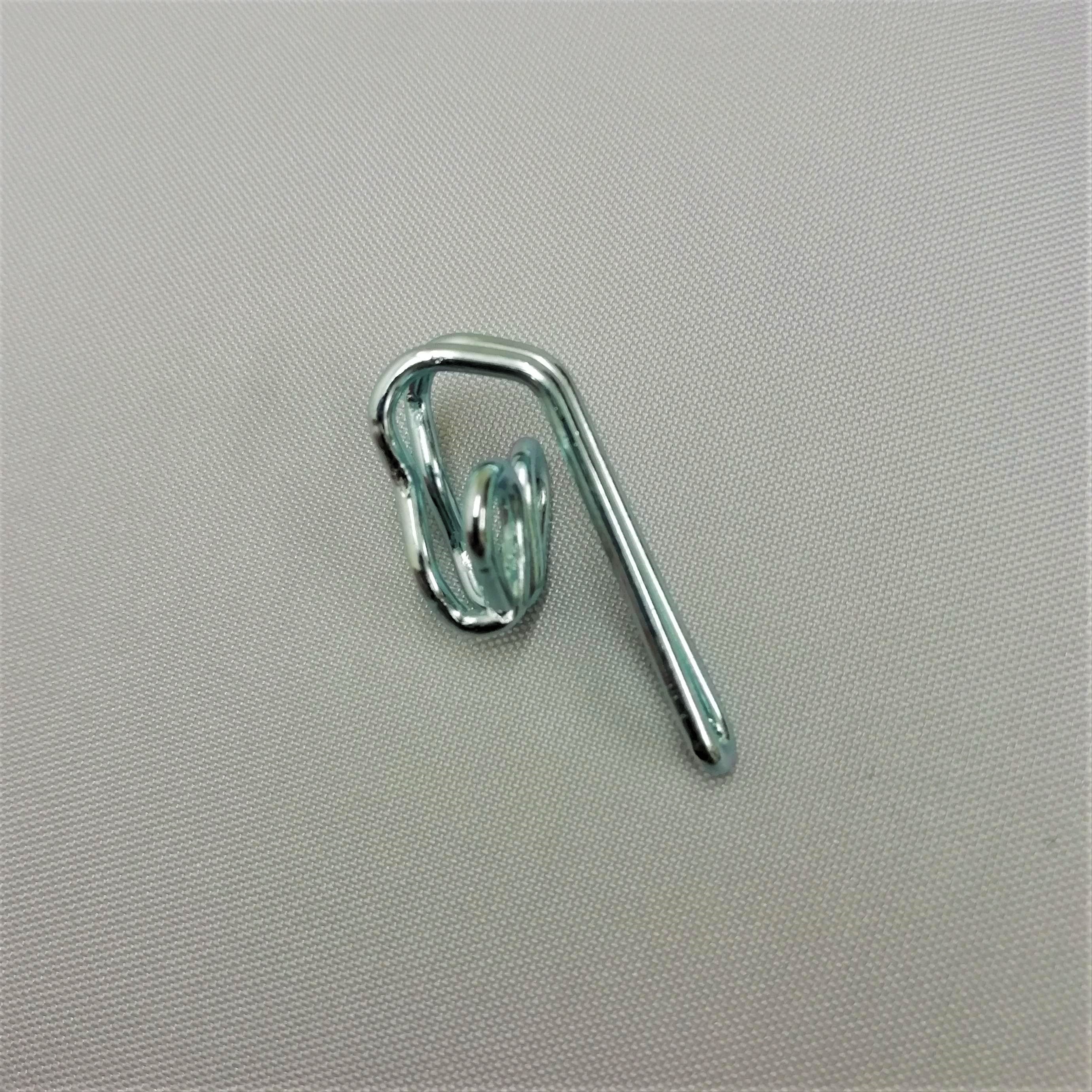 a silver coloured zinc curtain hook
